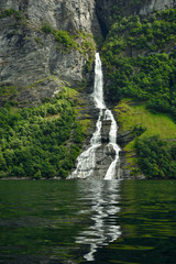 Fototapeta na wymiar The Seven Sisters unique waterfall at Geirangerfjord seens by boat trip, Sunnmore region, Norway, most beautiful fjords in the world, included on the UNESCO World Heritage.