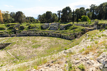 Old grown with grass stairs of Ancient ruins of Anfiteatro Romano Siracusa