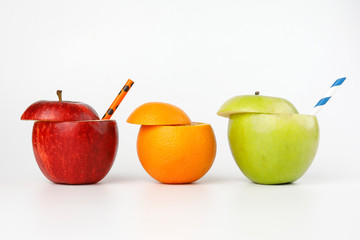 Healthy Red Green Cut Apple Orange recyclable paper straw juice drink idea concept on white background