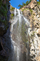 Obraz premium Butakovsky waterfall in the mountains of the city of Almaty, Kazakhstan. Summer in the mountains