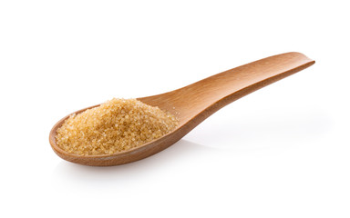 Brown sugar in wooden spoon on white background