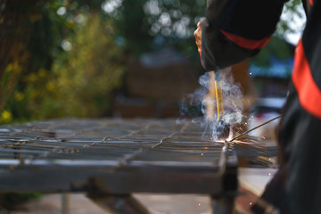 Worker labor welding metal