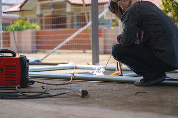 Worker labor welding metal