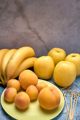 view of several ripe yellow and orange fruits