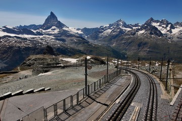 Railway of a train to Gornergrat with Matterhorn in the background on a sunny day