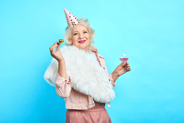 stylish smiling woman in funny clothes having fun on her Birthday. close up photo. isolated blue bacakground, lifestyle, free time - 278580997