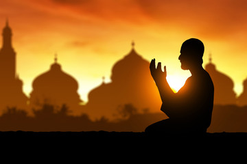 Fototapeta na wymiar Silhouette of muslim man praying