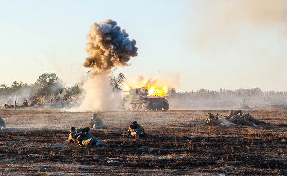 Explosions of bombs and shells. Reconstruction of the battle of world war II. Battle for Sevastopol. Reconstruction of the battle with explosions. Tanks and soldiers during the battle.