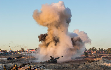 Fototapeta premium Explosions of bombs and shells. Reconstruction of the battle of world war II. Battle for Sevastopol. Reconstruction of the battle with explosions. Tanks and soldiers during the battle.
