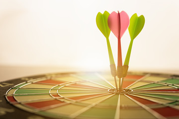Fototapeta premium Three arrows hitting on center og dartboard.business goal success concept