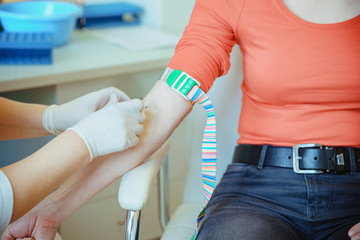 Woman in hospital for blood collection. Blood tests for the disease in the laboratory