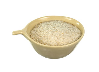 Pile of breadcrumbs in a bowl isolated on white background