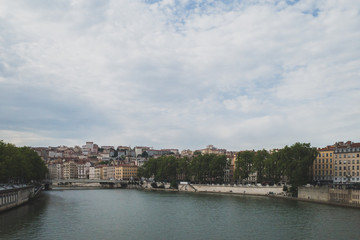 Obraz premium Buildings and bridges over the Saone River in downtown Lyon, France