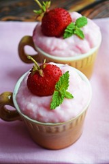 Delicious strawberry pudding in a ceramic Cup and fresh strawberries.Healthy diet.