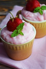 Delicious strawberry pudding in a ceramic Cup and fresh strawberries.Healthy diet.
