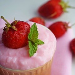 Delicious strawberry pudding in a ceramic Cup and fresh strawberries.Healthy diet.