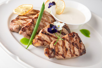 Grilled fish fillet: dorada, cod, halibut, pollock, tilapia. Seafood. Banquet festive dishes. Fine dining restaurant menu. White background.