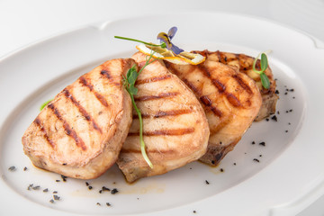 Grilled salmon fish fillet (red fish). Seafood. Banquet festive dishes. Fine dining restaurant menu. White background.