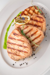 Grilled salmon fish fillet (red fish). Seafood. Banquet festive dishes. Fine dining restaurant menu. White background.