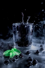 Natural water, water with blackberry, splash in a glass, water for health, refreshing drinks, healthy concept