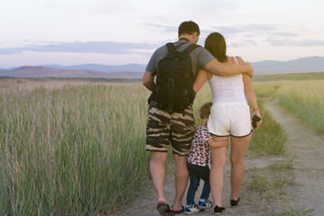 family walking in field