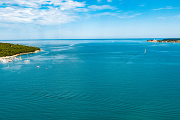 Fototapeta na wymiar Aerial ocean view of the green seaside and some islands
