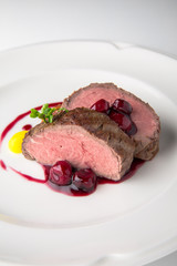 Filet mignon Beef, or Pork. Grilled young calf tenderloin with berries, mashed potatoes. Banquet festive dishes. Fine dining restaurant menu. White background. 