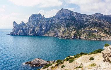 The sea coast of the Crimea, the landscape of the mountains and the sea in the village of Novy Svet