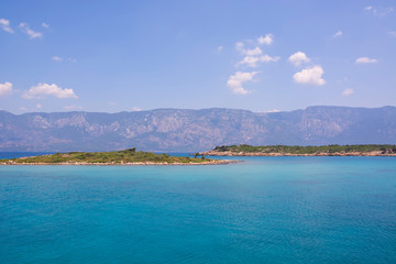 Aegean Islands on mountains and blue sky background, Turkey. Tropical wallpaper, paradise beach