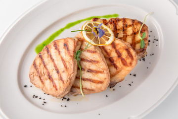 Grilled salmon fish fillet (red fish). Seafood. Banquet festive dishes. Fine dining restaurant menu. White background.
