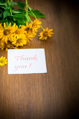 Fototapeta premium bouquet of yellow big daisies on a wooden