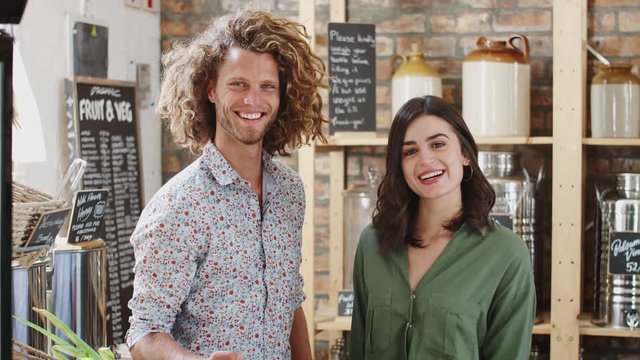 Portrait Of Couple Shopping In Sustainable Plastic Free Grocery Store