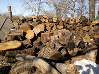 A pile of firewood stacked in the courtyard of the bath complex