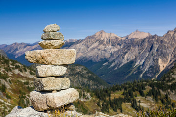 Stack of stones rocks trail marker cairn in the mountains, North Cascades National Park, Washington...