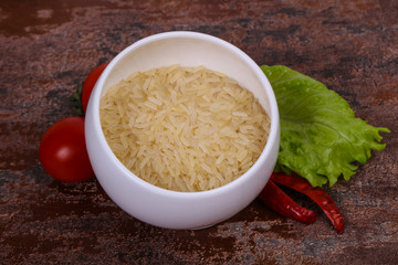 Raw uncooked rice in the bowl