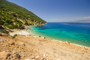 Obraz premium Vouti beach, Kefalonia island, Greece. People relaxing at the beach. 
