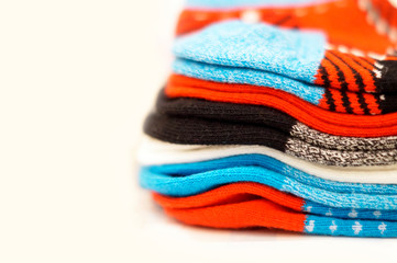 Cotton stack of colorful folded clothes on white empty space background