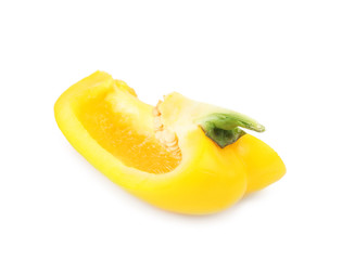 Cut yellow bell pepper with seeds isolated on white
