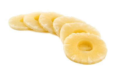Slices of delicious sweet canned pineapple on white background