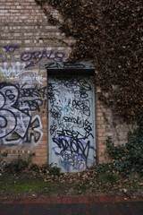 Door covered in graffiti