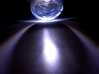 blue glass illuminated in the dark