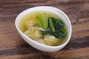 Asian traditional Wonton soup with herbs