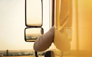 Man driving modern truck on country road © New Africa