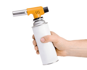 Hand holding manual gas torch burner (blowtorch) isolated on white background. Serie of tools.