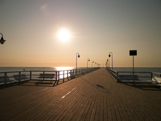Fototapeta na wymiar Sunrise over pier in Gdynia, Poland.