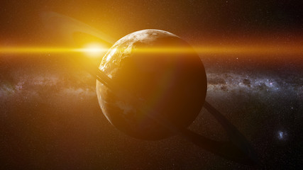Earth like alien planet with ring system lit by a distant sun