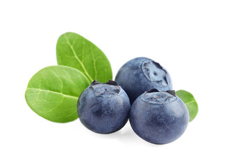 Fresh raw tasty blueberries with leaves isolated on white