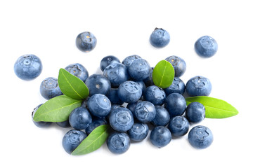 Fresh raw tasty blueberries with leaves isolated on white
