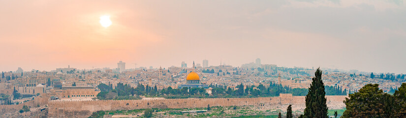 Panoramic view of Jerusalem old city and the Temple Mount during a dramatic colorful sunset