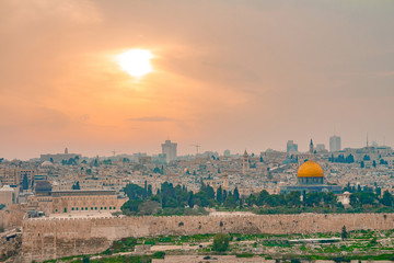 Panoramic view of Jerusalem old city and the Temple Mount during a dramatic colorful sunset
